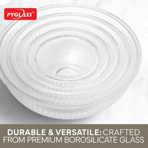 Stacked set of clear borosilicate glass mixing bowls with a branded logo placed on a white marble surface.