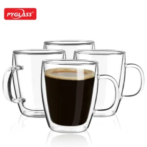 Set of double wall glass coffee mugs, one filled with coffee, showcasing their elegant and heat-resistant design.