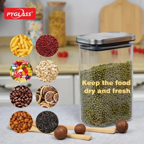 Glass food storage container with steel lid, filled with green beans, surrounded by examples of stored foods like pasta and coffee beans. Text reads 'Keep the food dry and fresh.'