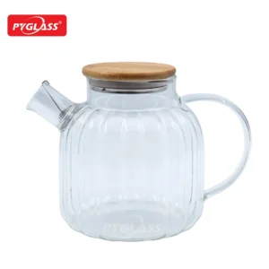 Transparent glass teapot with wooden lid, curved handle, and short spout against a white background. Features PYGLASS logo.