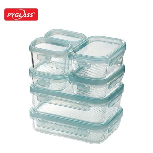 A set of stackable glass food storage containers with light blue sealing lids, shown in varying sizes.
